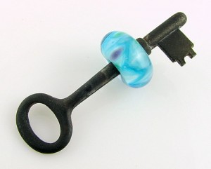 Worrkey, lampworked frit bead on a vintage skeleton key